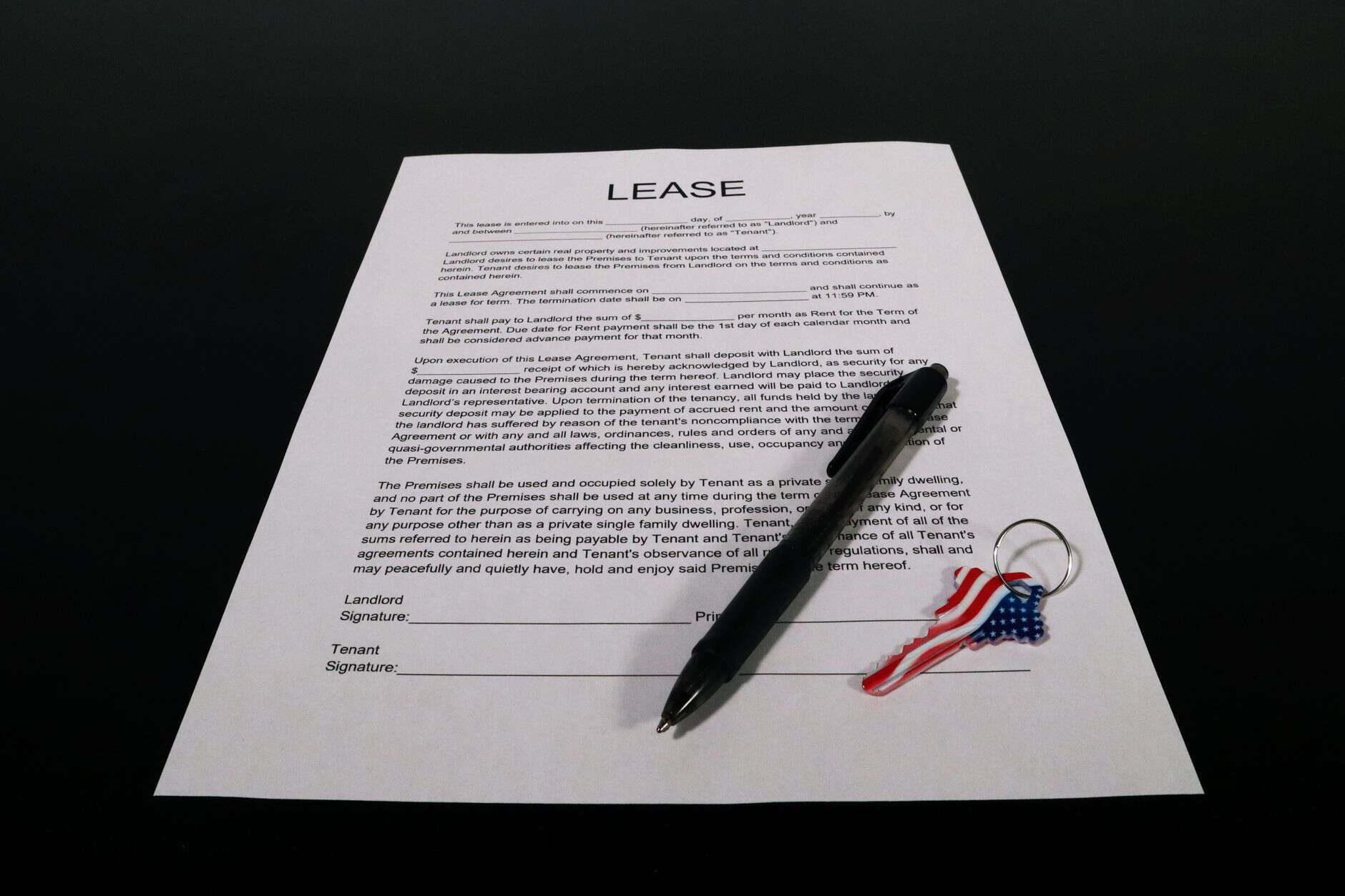 lease agreement document with pen and keychain