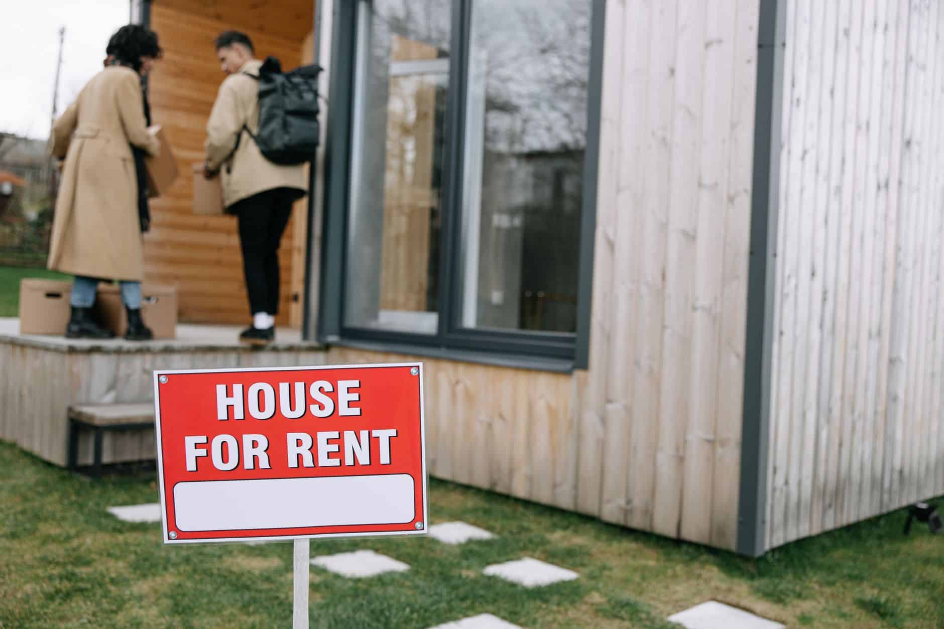 red and white signage outside the house